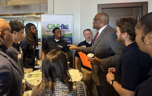 Students meeting with former Secretary of Education Patrick Tutwiler to describe their nonprofit